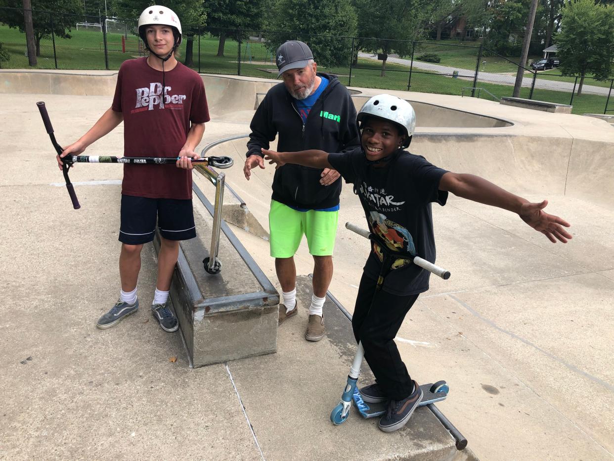 Sean Dauss, 14, from left, and Mark Osborne and Xzavier Long, 11, stand along the bowls of the O'Brien Skate Park in South Bend on Sept. 8. 2023.