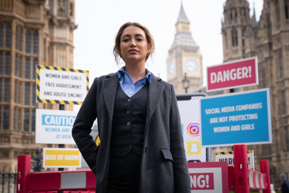 Georgia Harrison campaigning outside parliament (PA)