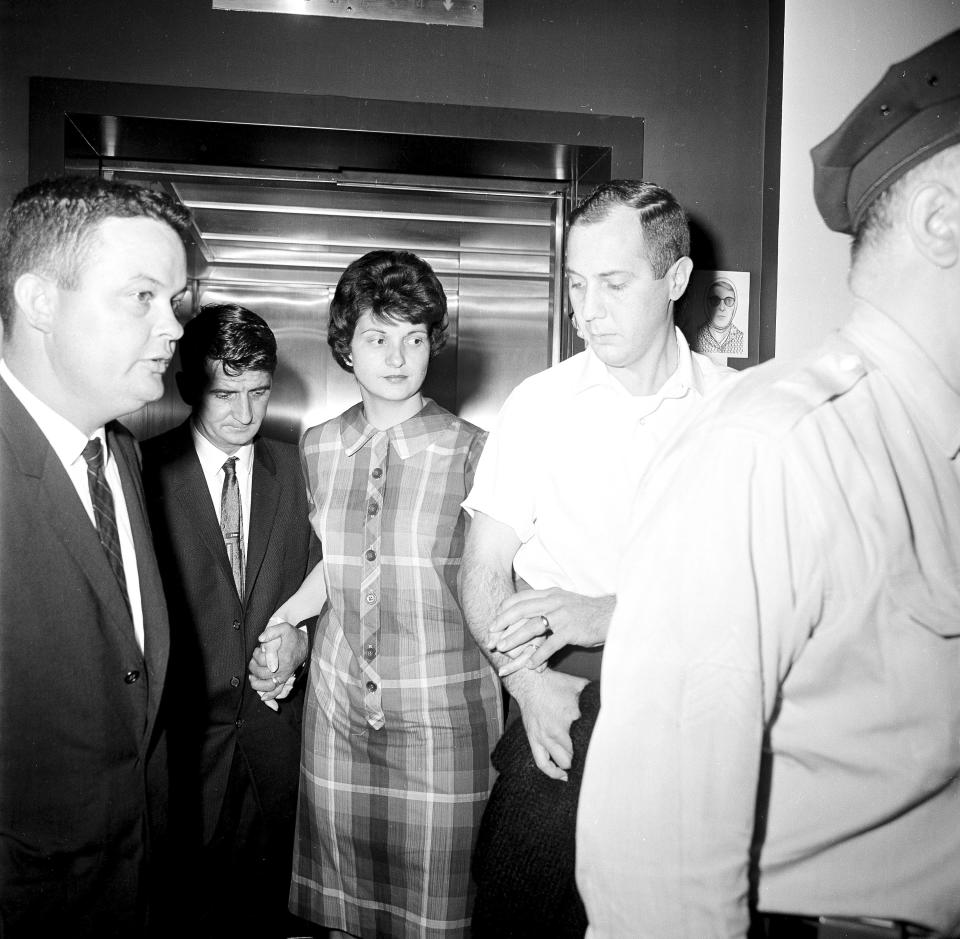 FILE - In this May 5, 1964 file photo, Dora Fronczak, whose baby was stolen from her arms in Michael Reese Hospital in Chicago, leaves the hospital with her husband, Chester. The baby was 37 hours old when a woman dressed as a nurse entered the room and took the child from Mrs. Fronczak, saying she was taking it to the nursery for examination. No trace of the child has been found since. (AP Photo/Harry L. Hall, File)