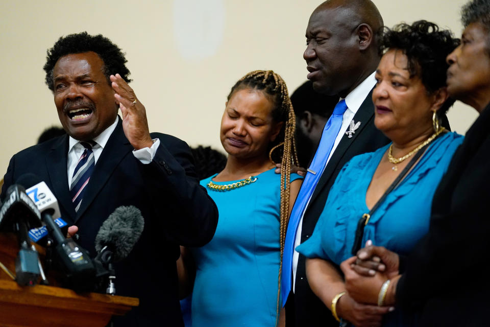 FILE - Garnell Whitfield Jr., left, the son of Ruth Whitfield, a victim of shooting at a supermarket, speaks with members of the media during a news conference in Buffalo, N.Y., Monday, May 16, 2022. After a weekend of gun violence in America, when shootings killed and wounded people grocery shopping, going to church and simply living their lives, the nation marked a milestone of 1 million deaths from COVID-19. The number, once unthinkable, is now a pedestrian reality in the United States, just as is the reality of the continuing epidemic of gun violence that kills tens of thousands of people a year. (AP Photo/Matt Rourke, File)