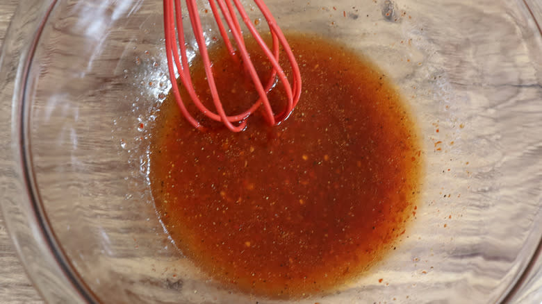 red marinade in clear bowl
