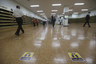 Social distancing signs are seen on the floor for a service to help stop the spread of new coronavirus at the Yoido Full Gospel Church in Seoul, South Korea, Sunday, July 5, 2020. The signs read: "Safe Distance." (AP Photo/Ahn Young-joon)