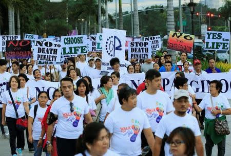 Participants join a "procession" against plans to reimpose death penalty, promote contraceptives and intensify drug war during "Walk for Life" in Luneta park, metro Manila, Philippines February 18, 2017. REUTERS/Romeo Ranoco