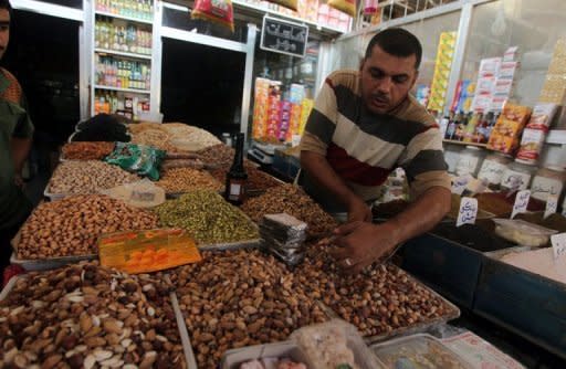 A Badghdad shopkeeper sells nuts on July 29, ahead of the upcoming Muslim holy month of Ramadan. Iraq is a less safe place than it was one year ago as security continues to deteriorate, an American watchdog warned on Saturday, just months ahead of a US withdrawal from the country