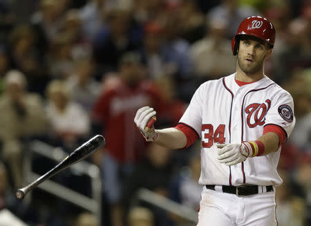 FILE PHOTO: Washington Nationals batter Bryce Harper flips his bat after striking out against the Atlanta Braves in Game 2 of their day-night doubleheader during the third inning of their MLB National League baseball game in Washington September 17, 2013. REUTERS/Gary Cameron