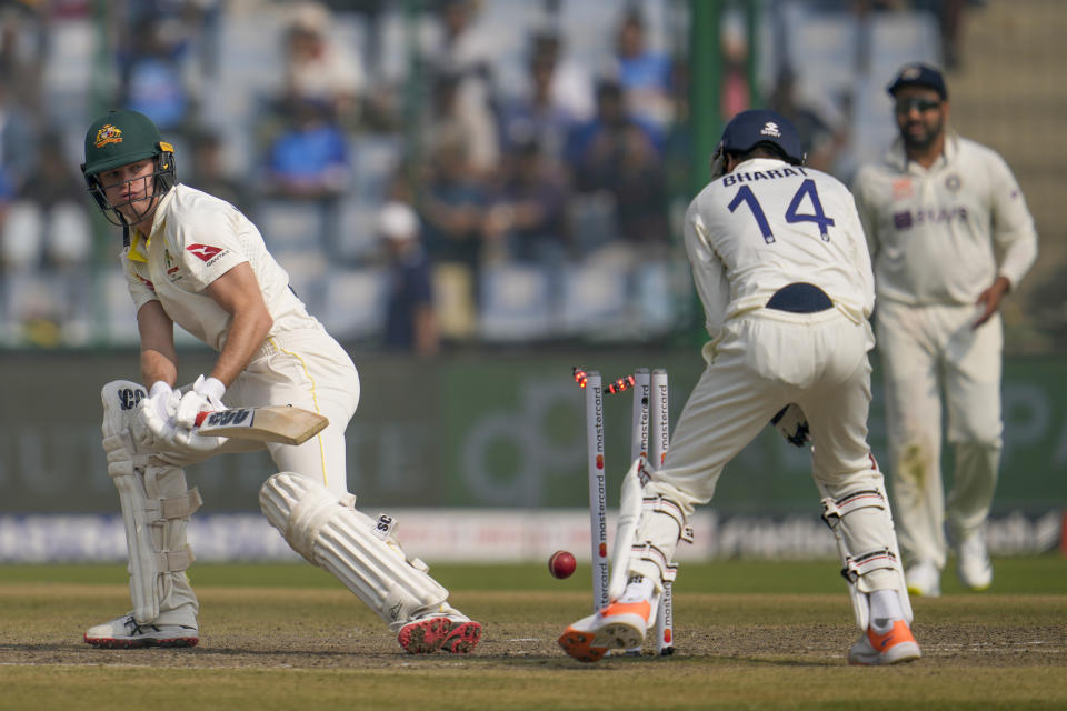 Australia's Matthew Kuhnemann, left, is bowled by India's Ravindra Jadeja during the third day of the second cricket test match between India and Australia in New Delhi, India, Sunday, Feb. 19, 2023. (AP Photo/Altaf Qadri)