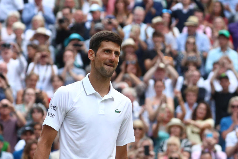 Tennis - Wimbledon - All England Lawn Tennis and Croquet Club, London, Britain - July 14, 2019  Serbia's Novak Djokovic celebrates winning the final against Switzerland's Roger Federer  REUTERS/Hannah McKay