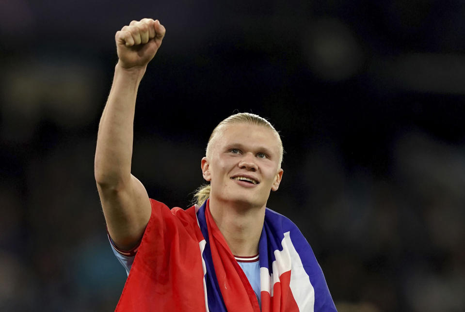 Manchester City's Erling Haaland celebrates at full time after the UEFA Champions League semi-final second leg match against Real Madrid at Etihad Stadium, Manchester. Man City beat Real Madrid 4-0 to advance to Champions League final. (Martin Rickett/PA via AP)