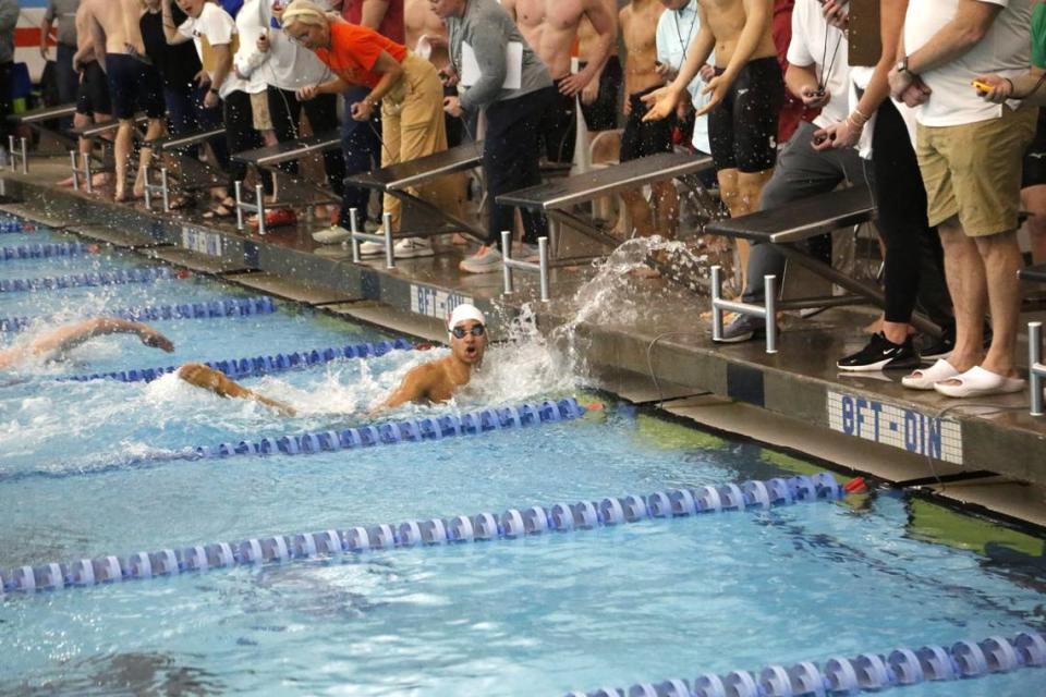 Paul Laurence Dunbar’s Seneca Oddo looks up at the timer after touching the wall on the last leg of one of his four races during the Region 8 Swimming Championships at Stivers Aquatic Center in Barbourville on Saturday. Jared Peck/jpeck@herald-leader.com