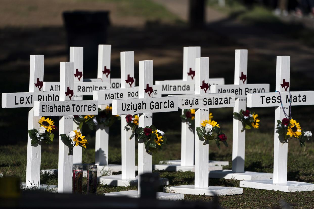 Crosses with the names of Tuesday's shooting victims are placed outside Robb Elementary School in Uvalde, Texas, on Thursday, May 26, 2022.