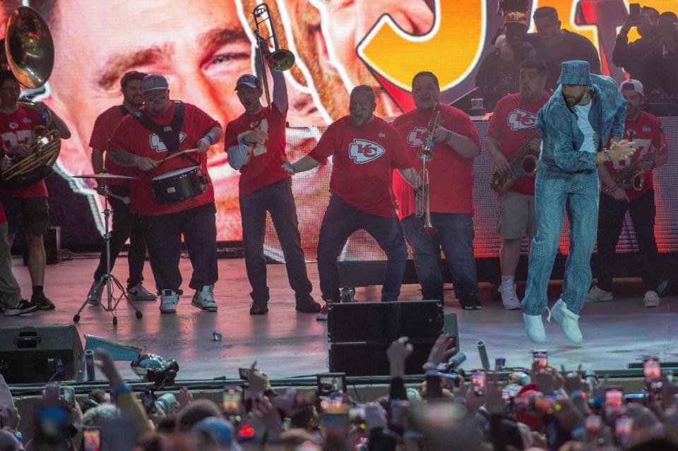 Travis Kelce smashes a Vince Lombardi Trophy replica on stage during Kelce Jam at the Azura Amphitheater on on Friday, April 28, 2023, in Bonner Springs.