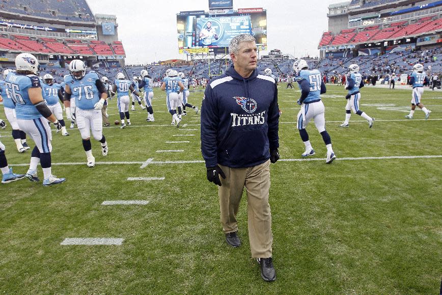 FILE - In this Dec. 15, 2013, file photo, Tennessee Titans head coach Mike Munchak watches his players warm up before an NFL football game against the Arizona Cardinals in Nashville, Tenn. person familiar with the decision say Titans President Tommy Smith has fired Munchak after three seasons as his head coach and 31 years combined with this franchise as a player and coach. The person spoke to The Associated Press on Saturday, Jan. 4, 2014, on the condition of anonymity because the Titans have not made an official announcement. (AP Photo/Wade Payne, File)