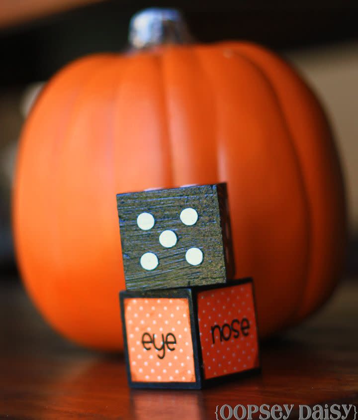 <p>With each roll, kids can add on another detail to their personal magnetic jack-o'-lantern, which is built from materials from the Dollar Store. </p><p><strong>Get the tutorial at <a href="http://www.oopseydaisyblog.com/2011/09/roll-a-jack-o-lantern-creative-carousel.html" rel="nofollow noopener" target="_blank" data-ylk="slk:Oopsey Daisy;elm:context_link;itc:0;sec:content-canvas" class="link ">Oopsey Daisy</a>.</strong></p><p><strong><a class="link " href="https://www.amazon.com/Glitz-Star-1-5Inch-Natural-Unfinished/dp/B01N5DDVBT/ref=sr_1_21?dchild=1&keywords=wooden+cubes&qid=1626722425&sr=8-21&tag=syn-yahoo-20&ascsubtag=%5Bartid%7C10050.g.3476%5Bsrc%7Cyahoo-us" rel="nofollow noopener" target="_blank" data-ylk="slk:SHOP DICE CUBES;elm:context_link;itc:0;sec:content-canvas">SHOP DICE CUBES</a><br></strong></p>