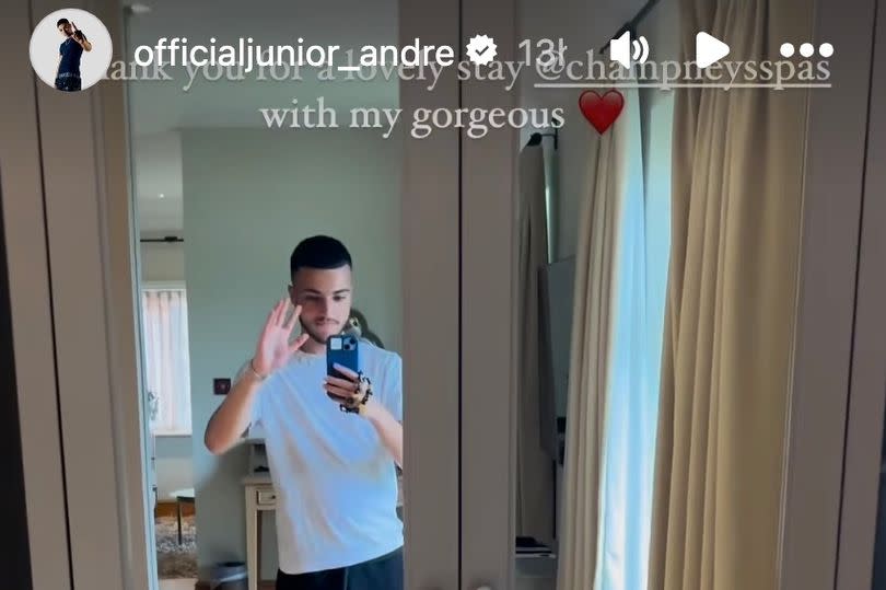 Junior Andre poses in the mirror