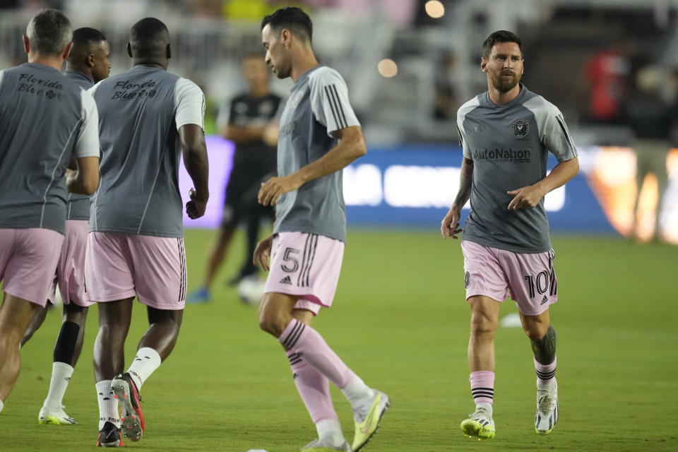 Inter Miami forward Lionel Messi (10) and teammates and teammates warm up for a Leagues Cup soccer match against Orlando City, Wednesday, Aug. 2, 2023, in Fort Lauderdale, Fla. (AP Photo/Rebecca Blackwell)