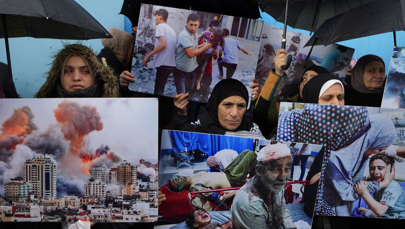 Palestinian Hamas supporters hold posters showing the Israeli bombardment on Gaza during a protest in front of the United Nations Relief and Works Agency headquarters in Beirut, Lebanon, on Jan. 30, 2024.