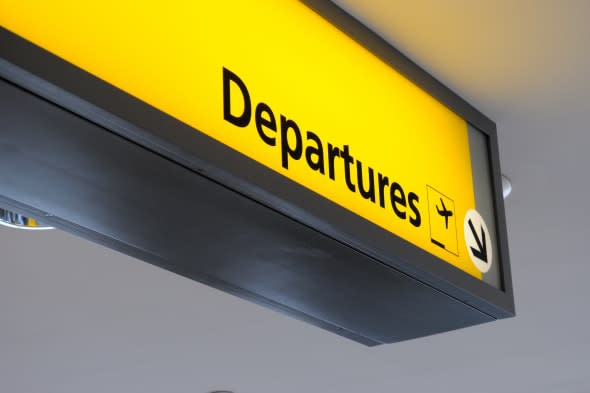 departure sign at an airport.