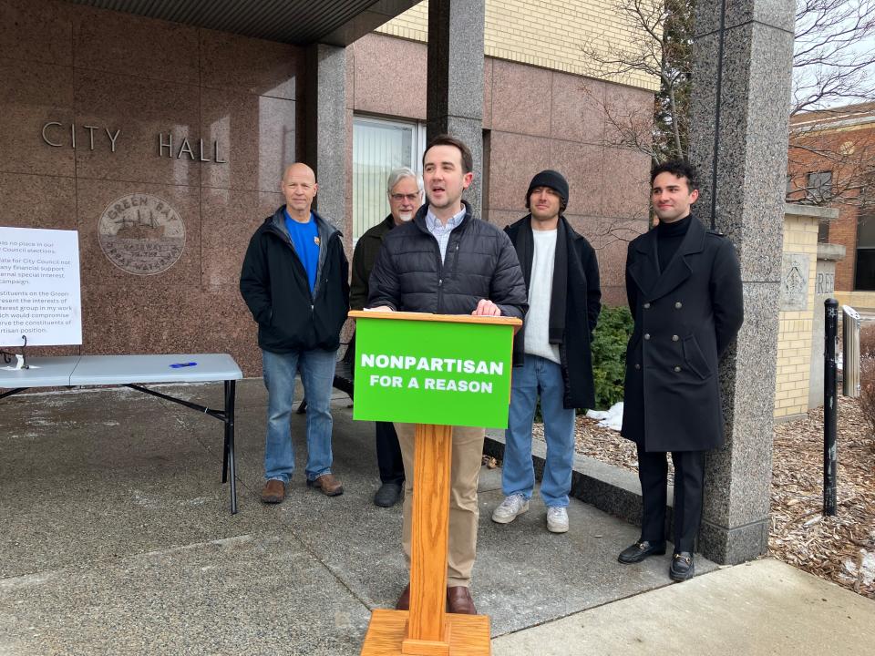 Green Bay City Council candidates Michael Poradek, front, and behind him, from left, Bill Galvin, Jim Hutchison, Tarl Knight and Dane Lasecki on Jan. 30 signed a pledge to remain nonpartisan during the 2024 spring election campaign.