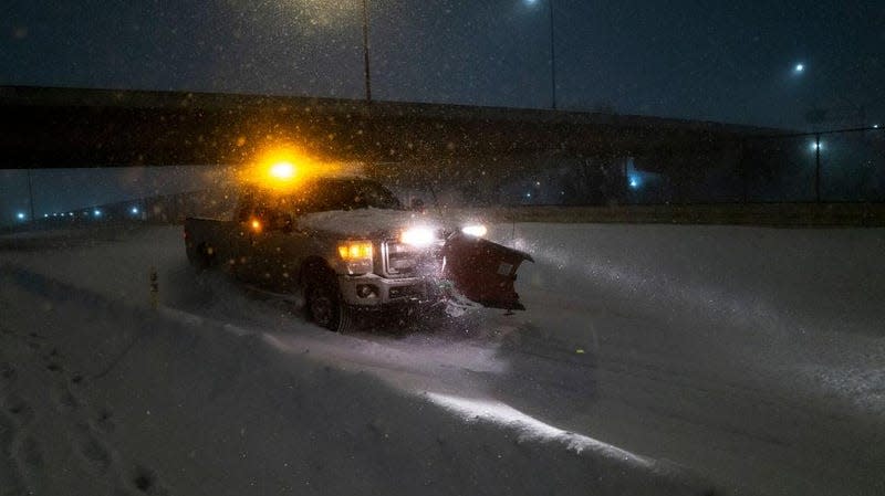 A plow drives through snow on Plymouth Avenue on February 23, 2023 in Minneapolis, Minnesota. 