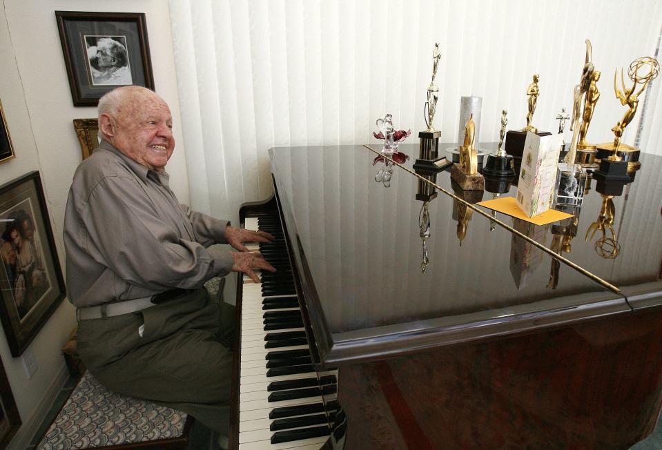 File photo of actor Mickey Rooney playing a piano at his home in Westlake Village