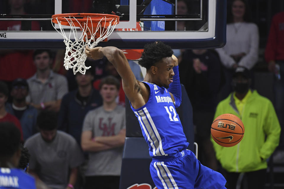 Memphis forward DeAndre Williams (12) reacts after a dunk during the second half of an NCAA college basketball game against Mississippi in Oxford, Miss., Saturday, Dec. 4, 2021. Mississippi won 67-63. (AP Photo/Thomas Graning)