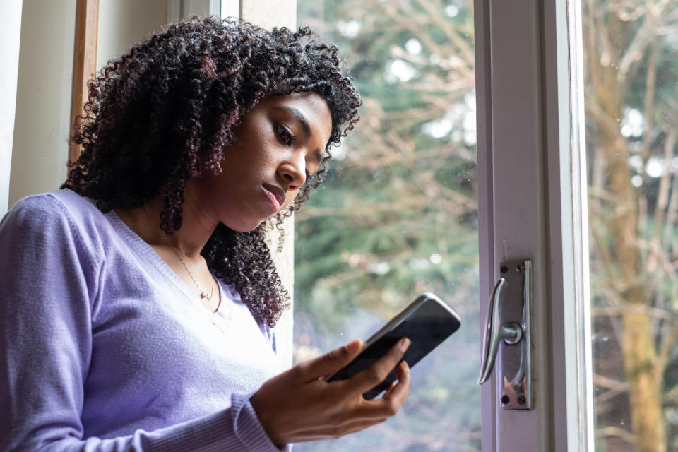 woman looking at her phone