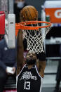 Los Angeles Clippers guard Paul George dunks during the first quarter of the team's NBA basketball game against the Oklahoma City Thunder on Friday, Jan. 22, 2021, in Los Angeles. (AP Photo/Ashley Landis)