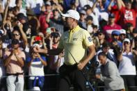 Webb Simpson pumps his fist after sinking the winning putt on the first playoff hole during the final round of the Waste Management Phoenix Open PGA Tour golf event Sunday, Feb. 2, 2020, in Scottsdale, Ariz. (AP Photo/Ross D. Franklin)