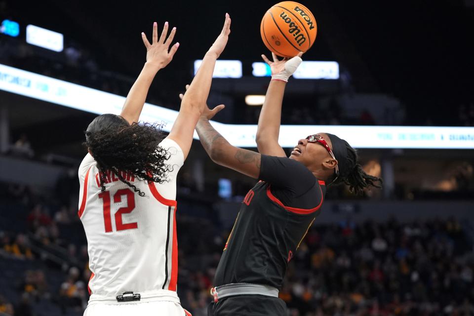 Maryland's Shyanne Sellers shoots over Ohio State's Celeste Taylor on Friday.