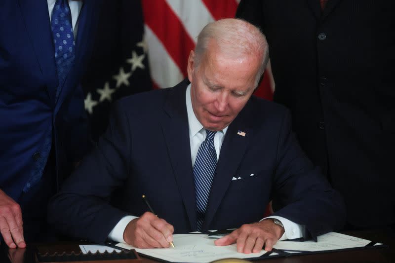 U.S. President Joe Biden signs "The Inflation Reduction Act of 2022" into law at the White House in Washington
