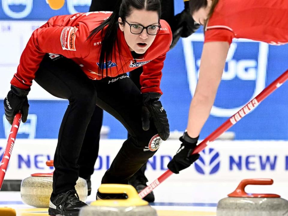 Canada skip Kerri Einarson directs a teammate in Sunday's bronze-medal game at the women's world curling championships in Sandviken, Sweden. Canada took an early 3-0 lead and held on for an 8-5 win over the hosts. (Jonas Ekstromer/TT News Agency via Associated Press - image credit)