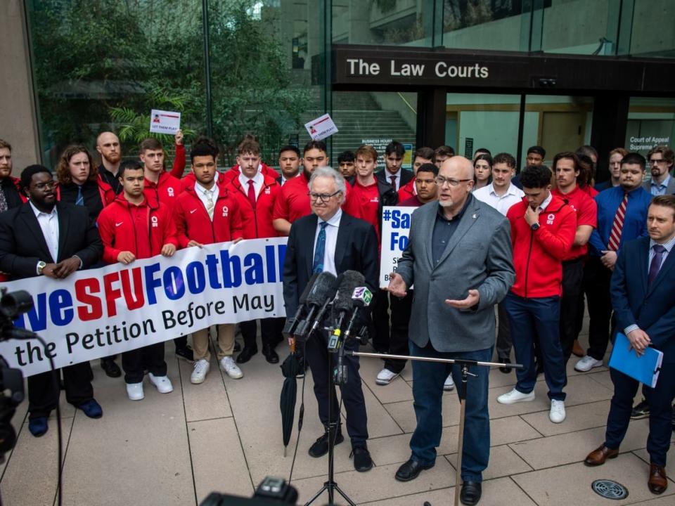 Last week, five SFU football players have filed an injunction application in the Supreme Court of B.C. to halt the university's decision to cancel its varsity football program. On Thursday afternoon, the university released a statement saying the team will not play the 2023 season.  (Ben Nelms/CBC - image credit)