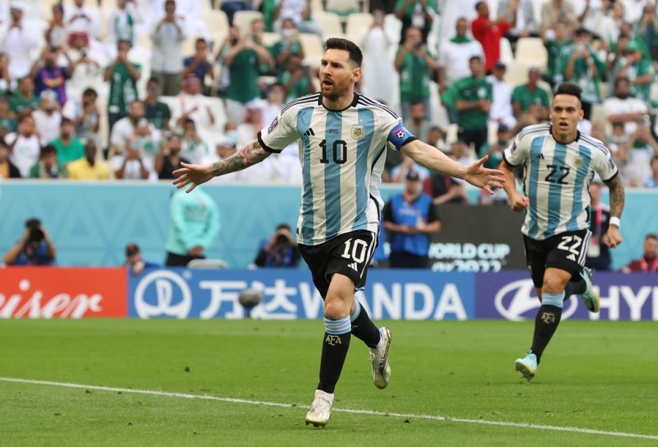 Lionel Messi celebrates after scoring a penalty to hand Argentina the lead (EPA)