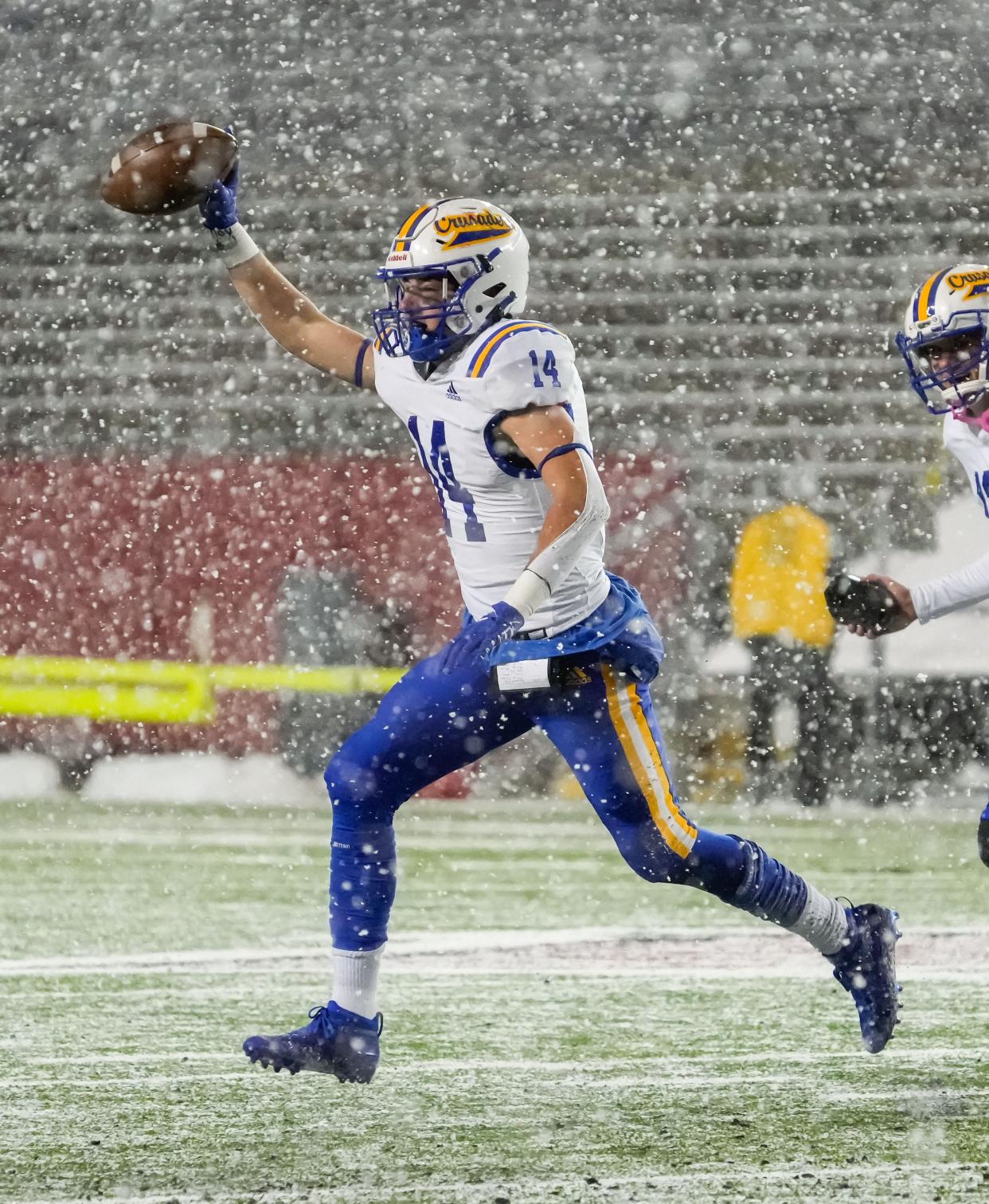 Catholic Memorial's Josh Oechsner (14) celebrates recovering a fumble during the WIAA Division 4 state championship football game against Columbus at Camp Randall Stadium in Madison on Thursday, November 17, 2022.