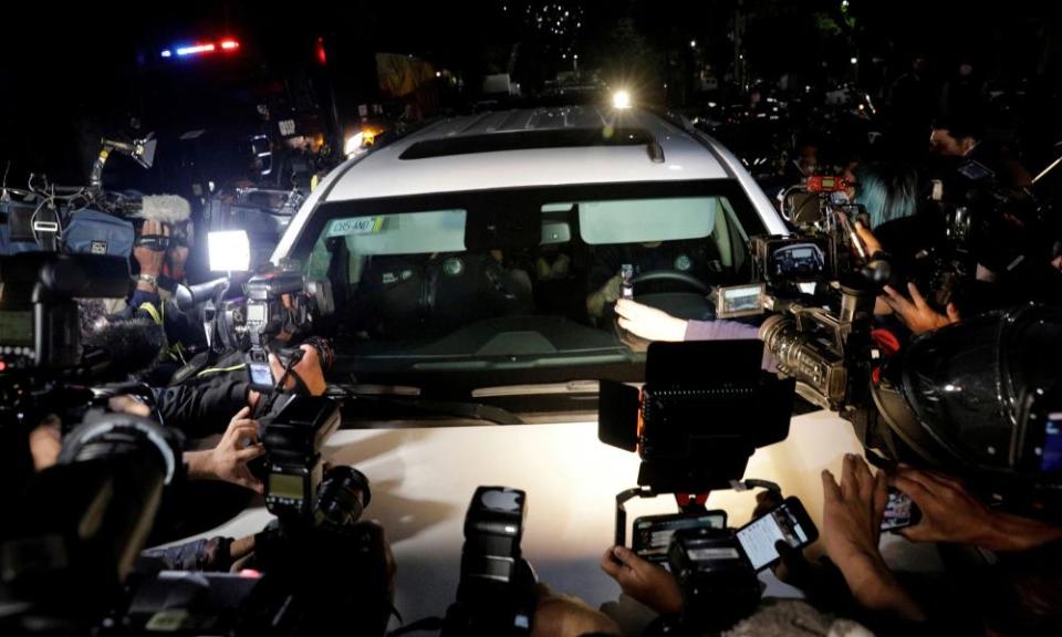 Reporters gather around a car, part of a convoy believed of transporting Emilio Lozoya after his extradition from Spain, in Mexico City last month.