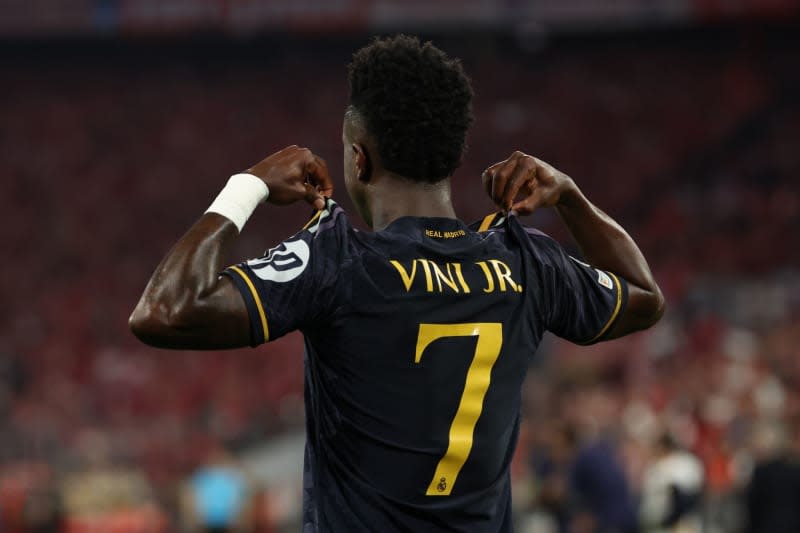 Real Madrid's Vinicius Junior celebrates scoring his side's second goal during the UEFA Champions League semi-final first leg soccer match between Bayern Munich and Real Madrid at Allianz Arena. Matthias Balk/dpa