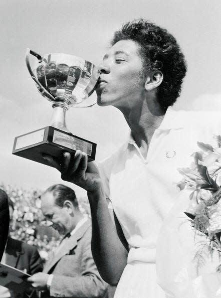 French Open Winner Althea Gibson Kissing Trophy on May 26, 1956.