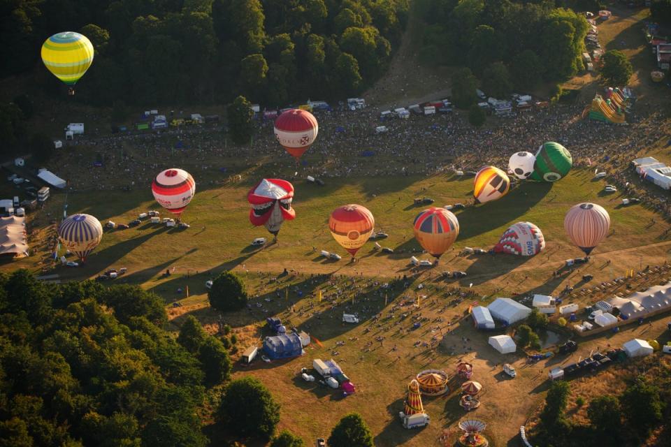 Hot air balloons begin to take off during the Bristol International Balloon Fiesta 2022 (Ben Birchall/PA) (PA Wire)