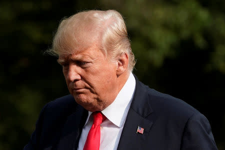 U.S. President Donald Trump walks on the South Lawn of the White House upon his return from Bedminster, New Jersey, to Washington, U.S., August 19, 2018. REUTERS/Yuri Gripas