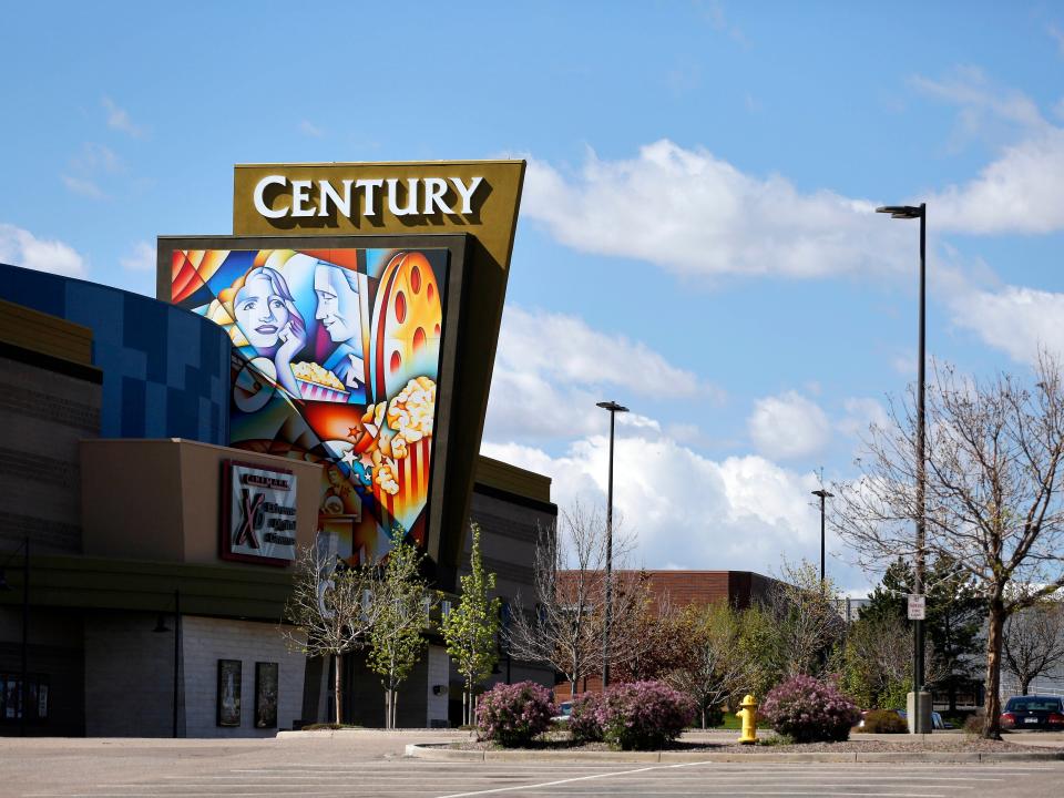 A colorful sign decorates the entrance of the Cinemark Century 16 movie theater in Aurora, Colo., on Wednesday, May 11, 2016.