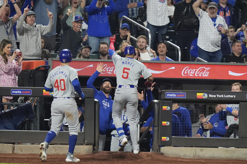 Chicago Cubs' Christopher Morel (5) celebrates with teammates after he and Mike Tauchman (40) scored on a two-run home run during the ninth inning of a baseball game against the New York Mets, Monday, April 29, 2024, in New York. (AP Photo/Frank Franklin II)