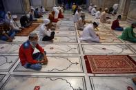 Muslim devotees wait to offer a special morning prayer to kick off the Eid al-Adha, the feast of sacrifice, at Jama Masjid mosque in New Delhi on August 1, 2020. (Photo by Money SHARMA / AFP) (Photo by MONEY SHARMA/AFP via Getty Images)