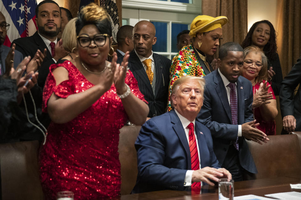 African American leaders applaud President Donald Trump as they end their meeting in the Cabinet Room of the White House, Thursday, Feb. 27, 2020, in Washington. (AP Photo/Manuel Balce Ceneta)