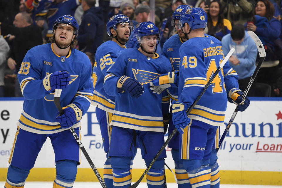 St. Louis Blues' Torey Krug (47) celebrates with teammates after scoring a goal against the Anaheim Ducks during the second period of an NHL hockey game, Saturday, Nov. 19, 2022, in St. Louis. (AP Photo/Jeff Le)
