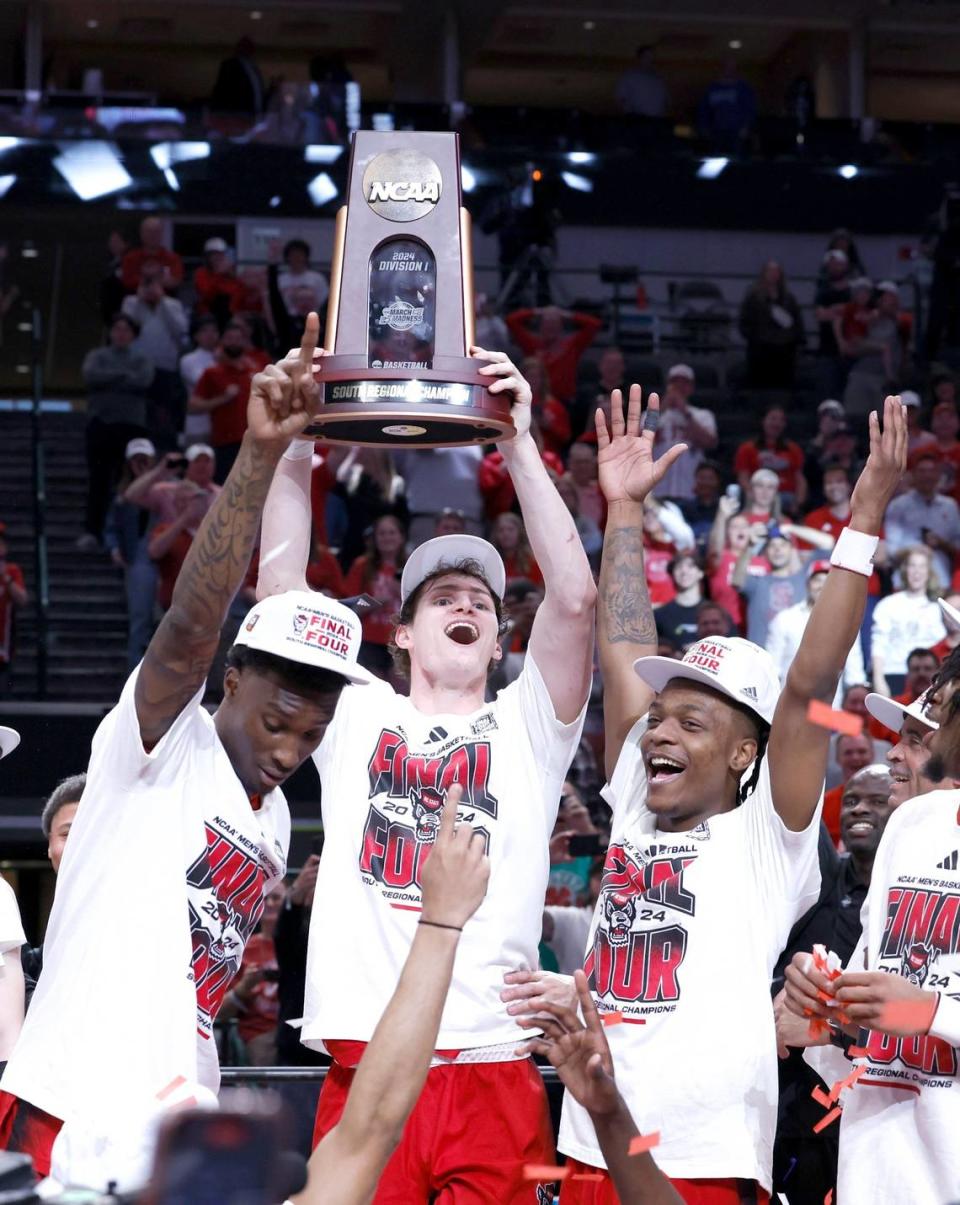 N.C. State’s Ben Middlebrooks holds up the South Regional trophy after N.C. State’s 76-64 victory over Duke in their NCAA Tournament Elite Eight matchup at the American Airlines Center in Dallas, Texas, Sunday, March 31, 2024.