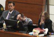 Marjory Stoneman Douglas High School shooter Nikolas Cruz looks down as Assistant State Attorney Mike Satz delivers an opening statement in the penalty phase of his trial at the Broward County Courthouse in Fort Lauderdale on Monday July 18, 2022. Cruz previously plead guilty to all 17 counts of premeditated murder and 17 counts of attempted murder in the 2018 shootings. (Carline Jean/South Florida Sun Sentinel via AP, Pool)