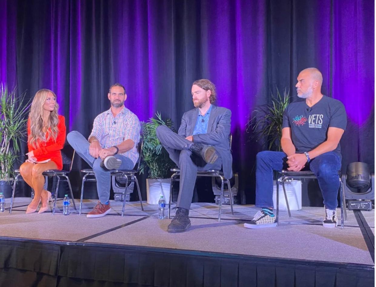 Dr. Nolan Williams, second from right, a Stanford Medicine associate professor of psychiatry and behavioral sciences, sitting alongside Amber and Marcus Capone, on the left, the founders of the nonprofit Veterans Exploring Treatment Solutions, or VETS.