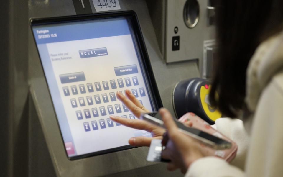 Passenger buying train tickets