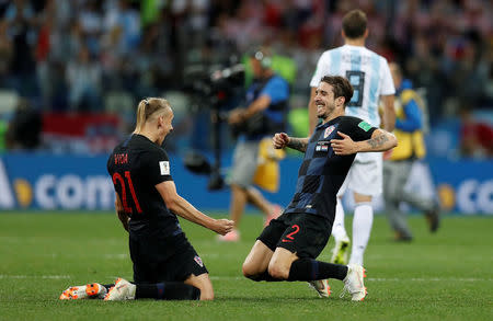 Soccer Football - World Cup - Group D - Argentina vs Croatia - Nizhny Novgorod Stadium, Nizhny Novgorod, Russia - June 21, 2018 Croatia's Domagoj Vida and Sime Vrsaljko celebrate after the match REUTERS/Matthew Childs