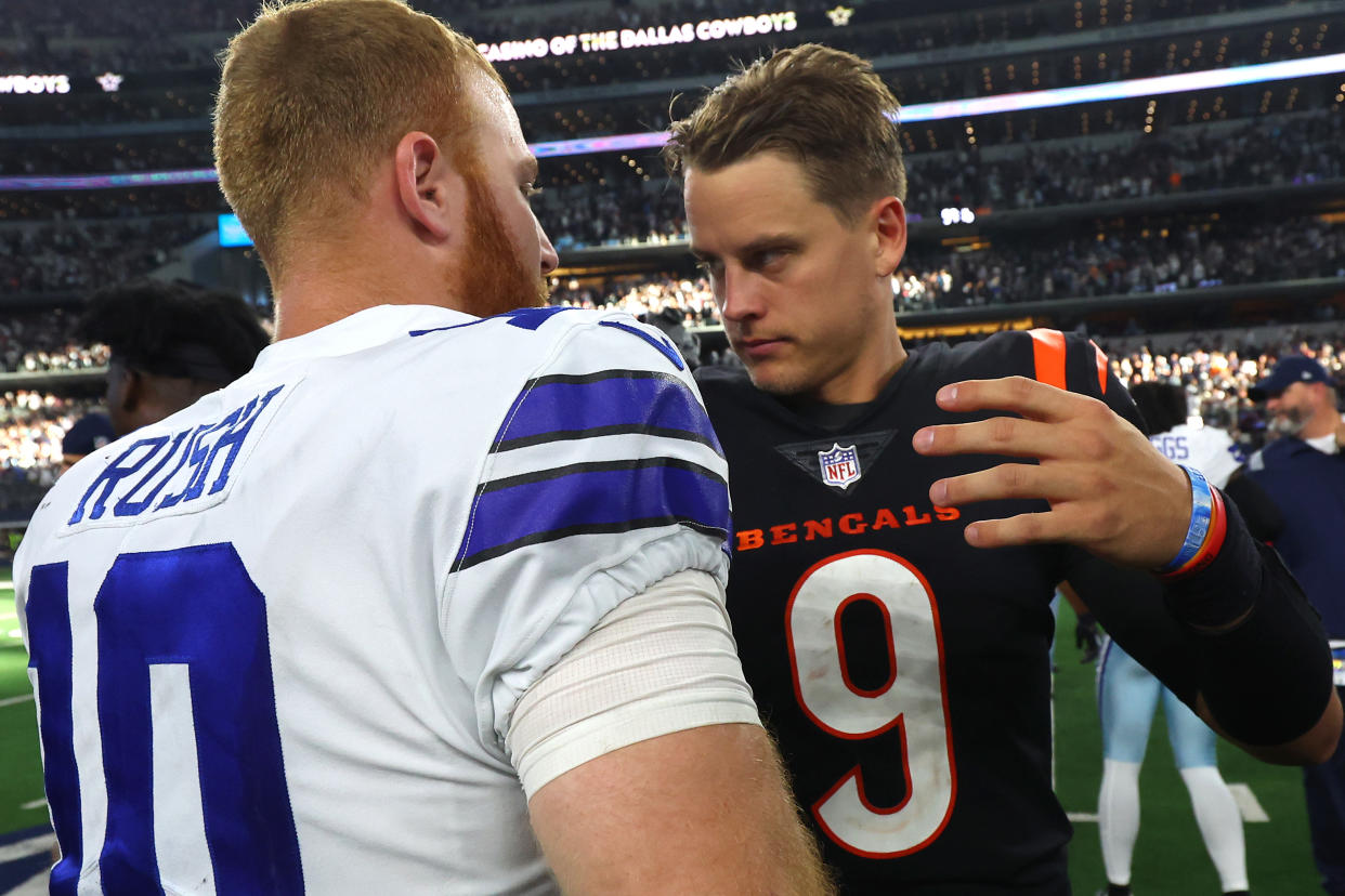 ARLINGTON, TEXAS - SEPTEMBER 18: Cooper Rush #10 of the Dallas Cowboys and Joe Burrow #9 of the Cincinnati Bengals embrace after the game at AT&T Stadium on September 18, 2022 in Arlington, Texas. (Photo by Richard Rodriguez/Getty Images)